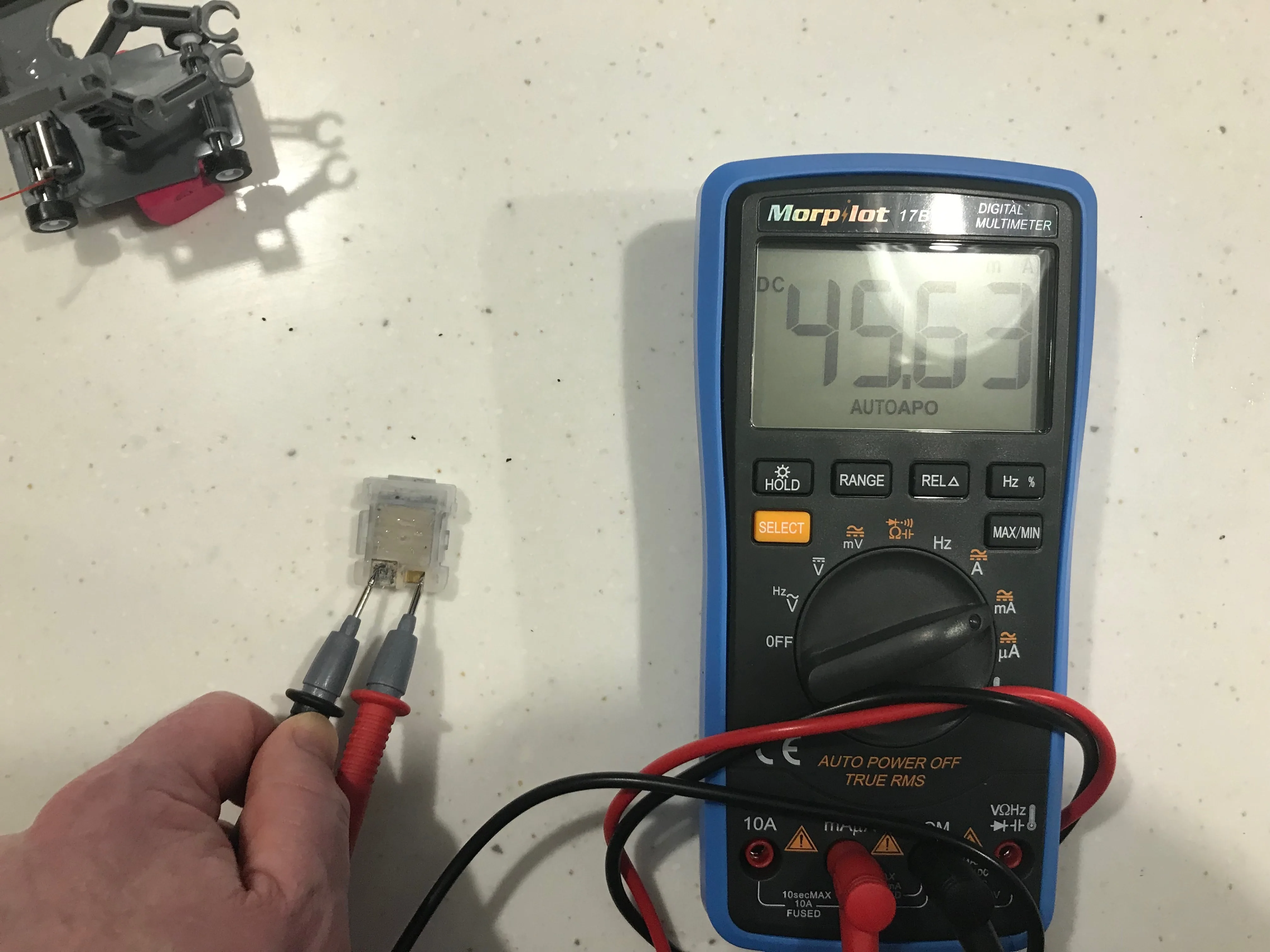 battery and multimeter reading 49 milliamps