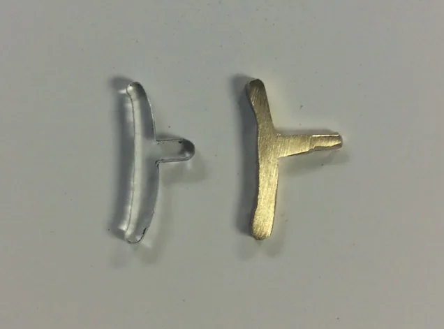 perspex and brass button