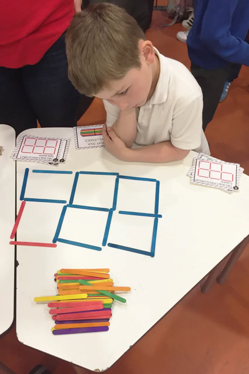 Boy doing maths puzzle