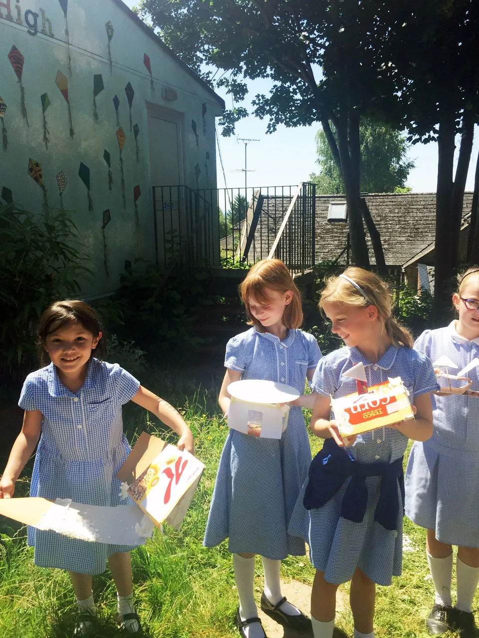 Girls displaying their UV shelters